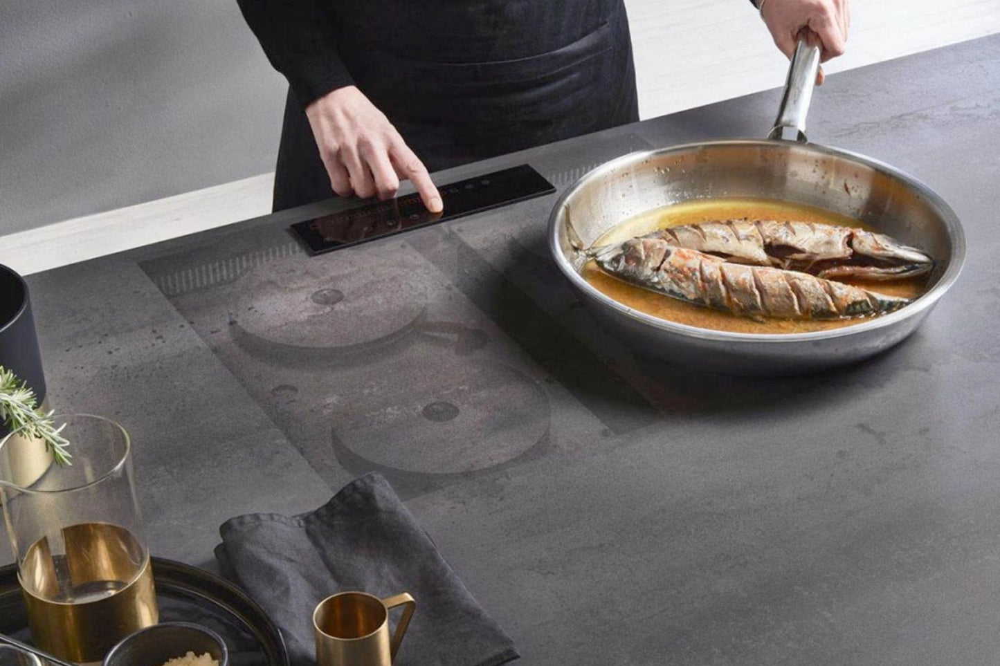 Small invisible cooktop under ceramic countertop — seamless worktop with no visible burner or appliance